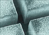 70-µm wide trenches cut into a 350-µm thick layer of artificial diamond 